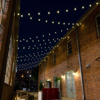String lights against building Photo